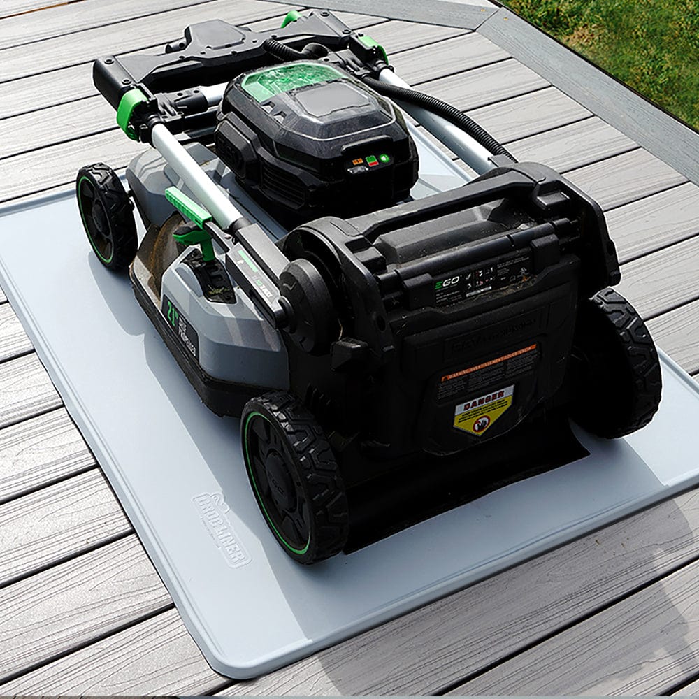 Everything Mat® Multi-Purpose Rubber Floor Mat with a motor appliance on top