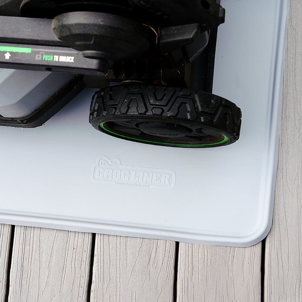 Everything Mat® Multi-Purpose Rubber Floor Mat with a motor appliance on top